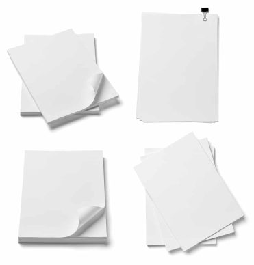 Close,Up,Of,Stack,Of,Papers,On,White,Background